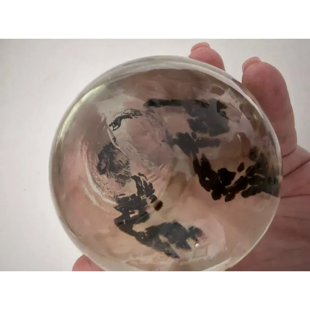 Vintage art glass paperweight with black Inclusions